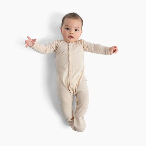baby wearing merino all-in-one dusky peach