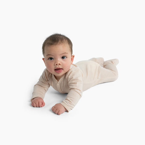 baby on tummy merino all-in-one dusky peach