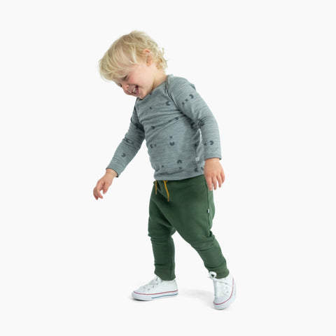Child wearing merino baby long sleeve top grey marl catch em print