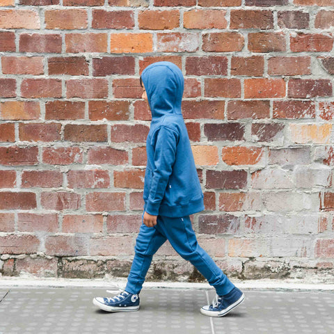 Child wearing organic cotton merino hoodie denim blue