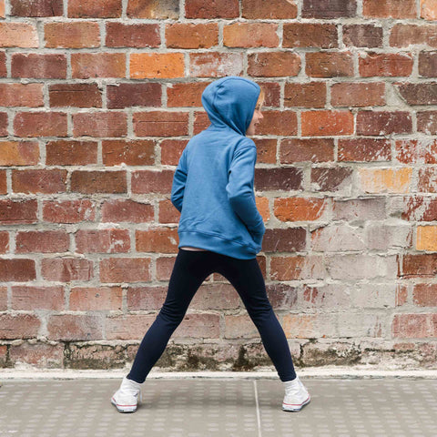 Girl wearing organic cotton merino hoodie denim blue