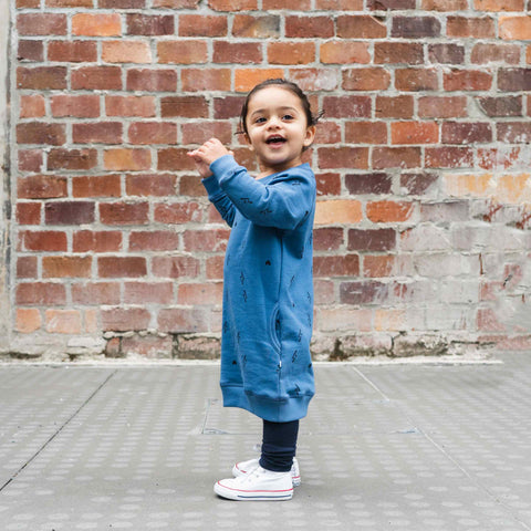 Girl wearing Organic cotton merino baby trackie dress denim blue lightning heart