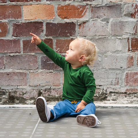 Boy wearing organic cotton merino baby slouch trackie denim blue front seam