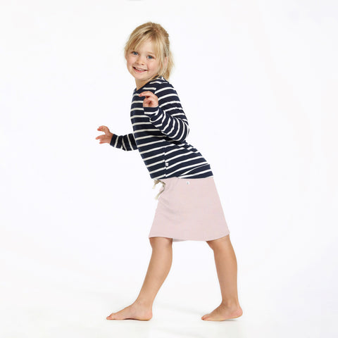 Girl wearing merino slouch skirt powder pink