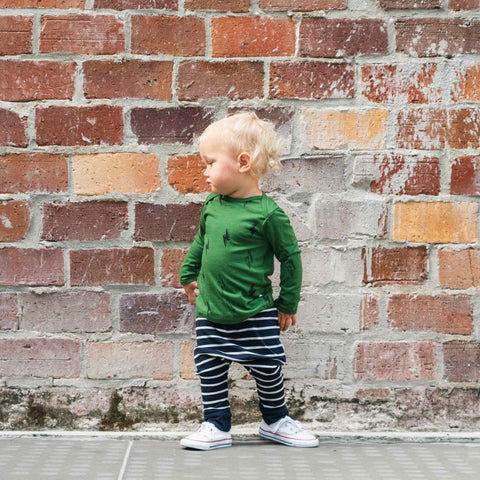 Child wearing merino baby slouch pants navy Breton stripe