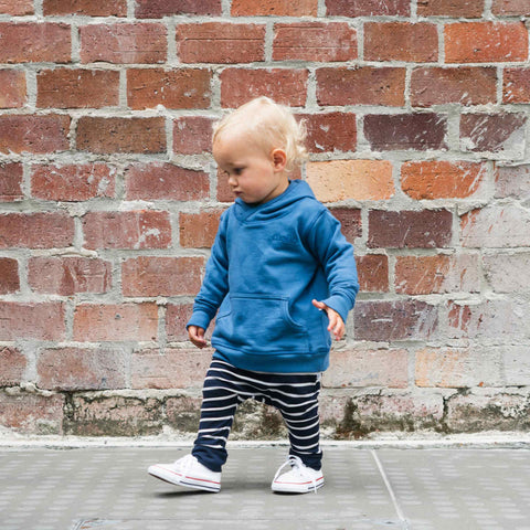 Boy wearing merino baby slouch pants navy Breton stripe