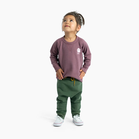 Toddler wearing cotton merino sweater plum