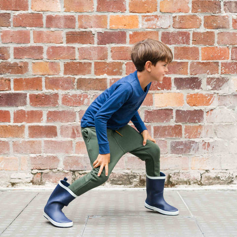 Child wearing organic cotton merino trackie pants olive green