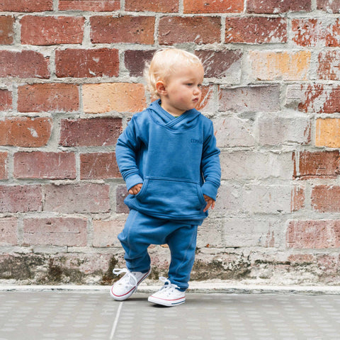 Child wearing organic cotton merino baby slouch trackie denim blue front seam