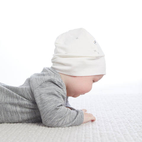 baby wearing merino baby hat natural white allover x